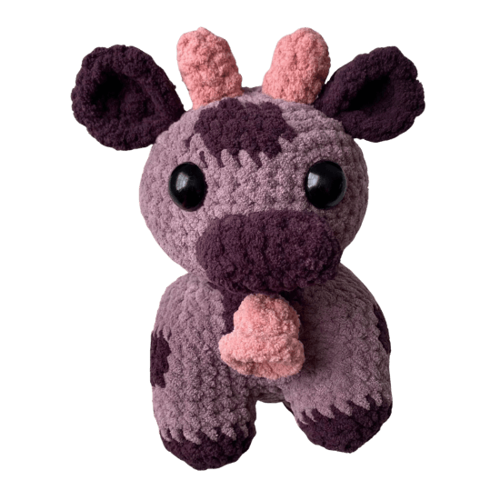 Cute cow with bell plush toy crafted by Monse's Crochet Creations.